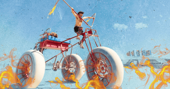 A shirtless white man riding a giant tricycle in the desert surrounded by flames on a blue background.