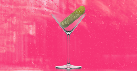 A pickle in a martini glass.