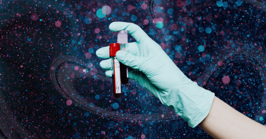 A hand in a blue plastic glove holding up two tubes of blood on a glittery background.
