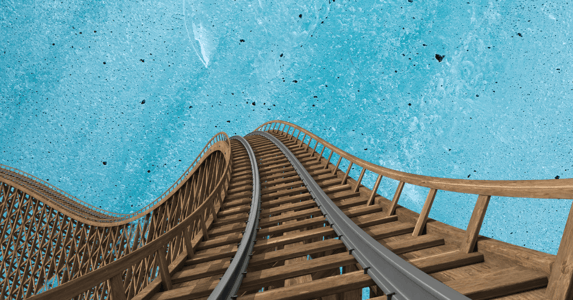 A roller coaster track against a blue background.