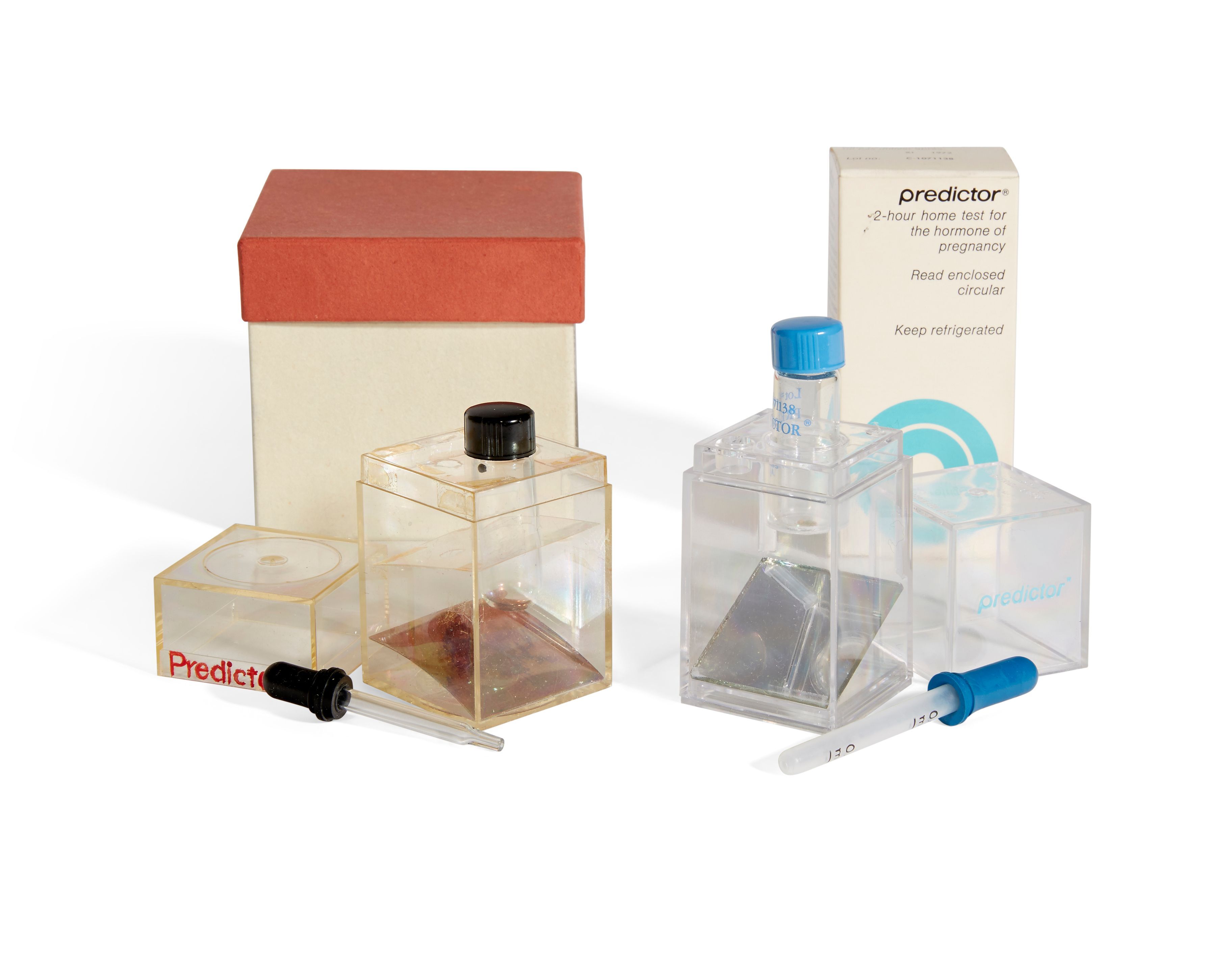 Side-by-side of Crane's original prototype and the first commercial version of the Predictor pregnancy test, photographed for Bonhams auction house.