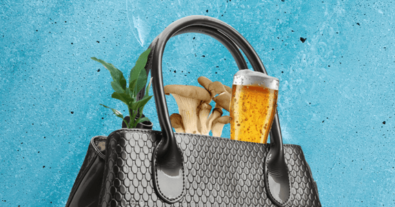 A black leather purse with a plant, mushrooms, and a glass of beer sticking out of it on a blue background.