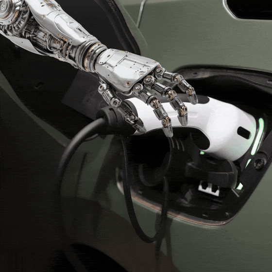 A robot hand charges an EV. 