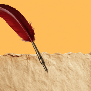 A quill pen writes a checkmark