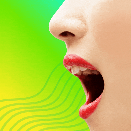 A woman's open mouth with vibrating lines coming out of it.
