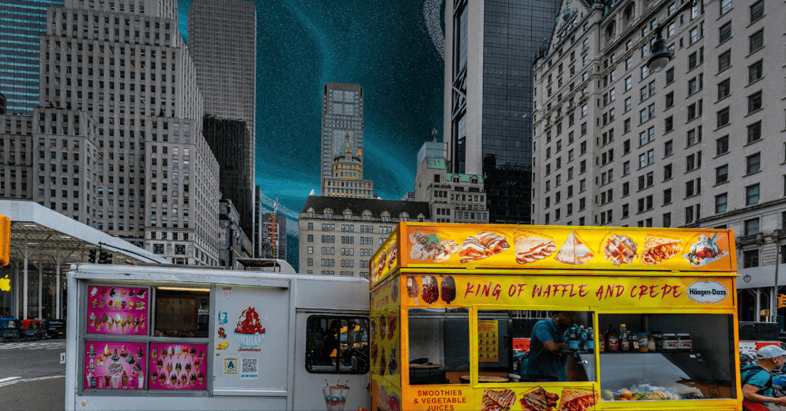 Two food trucks in a city. 