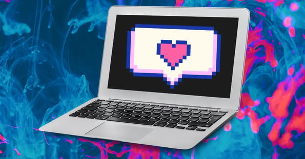 A laptop with a pixelated chat bubble and a heart.