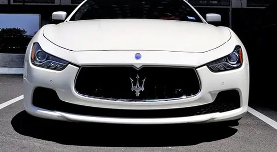 As luxury carmakers flood markets with new rides, their old cars lose value