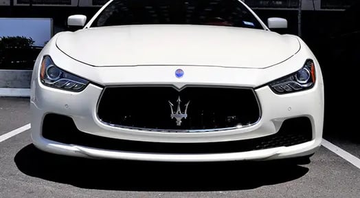 As luxury carmakers flood markets with new rides, their old cars lose value