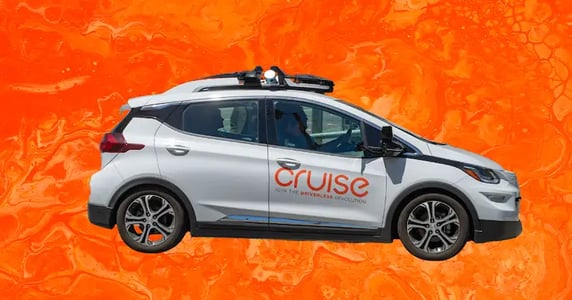 A GM Cruise vehicle on an orange background.