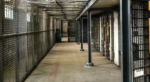 Without the backing of big banks, private prison stock prices plummet