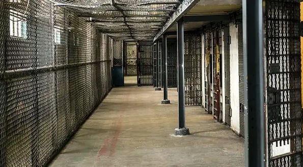 Without the backing of big banks, private prison stock prices plummet