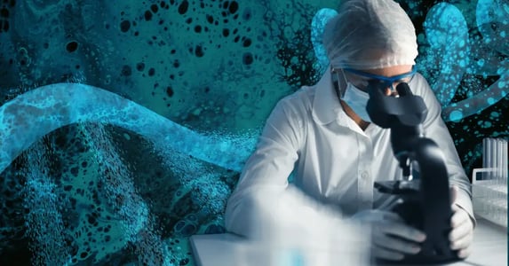A woman in a hairnet, goggles, surgical mask, and white lab coat looking into a microscope with a strand of DNA on a blue background.