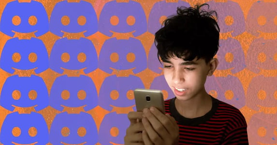 A teenage boy looks at his phone; in the background, a grid of blue Discord logos fades away in a gradient against an orange backdrop.