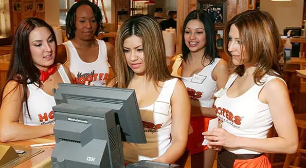 On the menu at Hooters: Chicken, cleavage… and cancer drugs