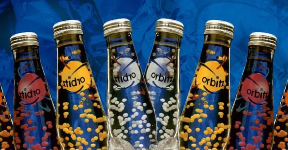 Eight bottles of Orbitz on a blue background.