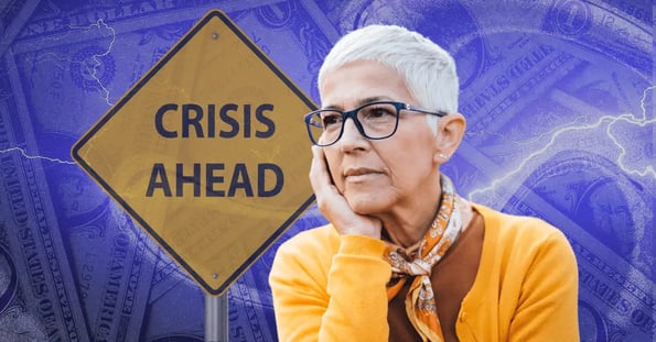 person standing in front of a 'crisis ahead' road sign