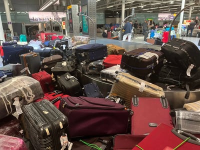 Luggage mayhem adds to airport chaos