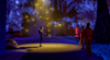 A scene from 'Uncanny Alley: A New Day' depicts a robot standing in a park at night talking to three figures in red jumpsuits.
