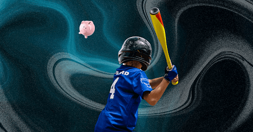 The back view of a boy in a blue baseball uniform swinging a yellow bat at a pink piggy bank.