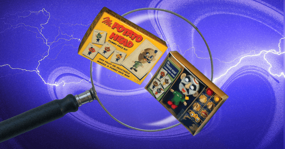 A magnifying glass hovers over a box containing an early Mr. Potato Head toy.