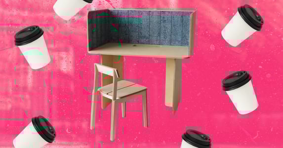 A wooden test with a blue interior panel surrounded by coffee cups. 