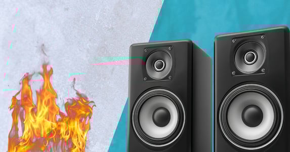 Two subwoofers face off against a fire.