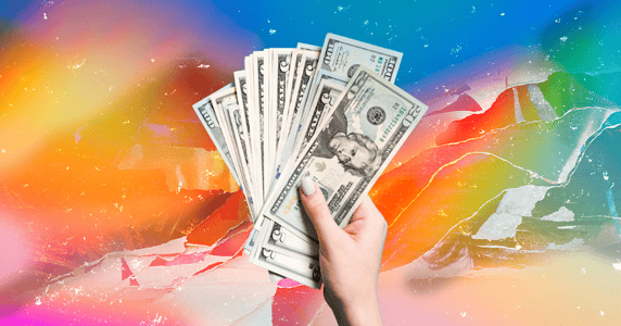 A hand holding cash against a rainbow background.