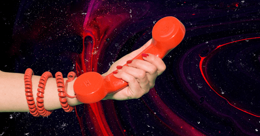 A woman extends a red phone receiver, its cord wrapped around her wrist.