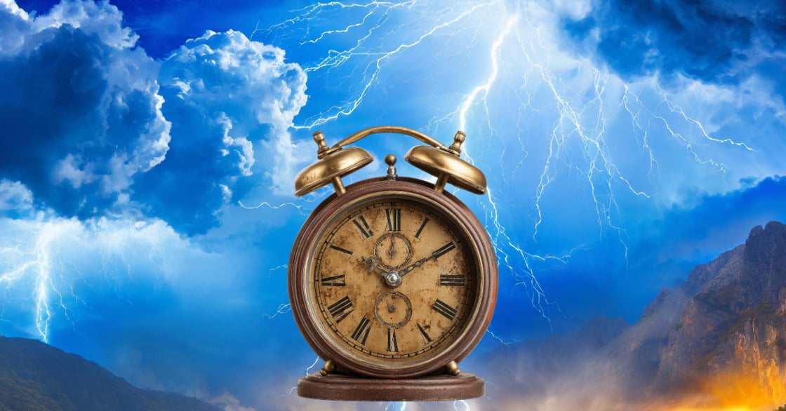 An alarm clock in front of lightning. 