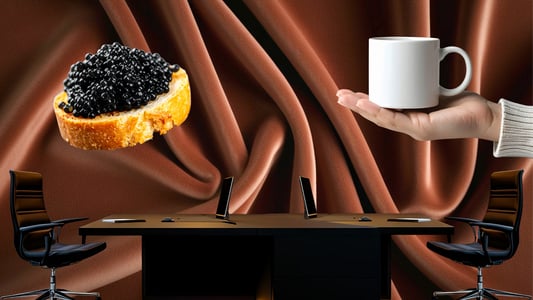 A desk and two chairs sit in front of a brown curtain. On one sized, an oversized hand holds out a white coffee mug. On the other is an oversized piece of bread topped with caviar.