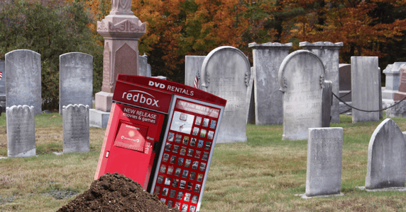 Redbox machine in a graveyard