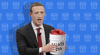 Mark Zuckerberg holding a bucket of meat