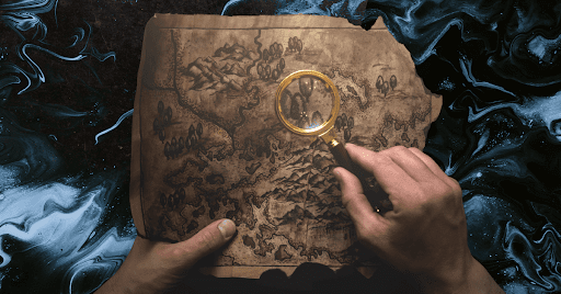 Two white hands holding a magnifying glass over a treasure map on a dark blue background.